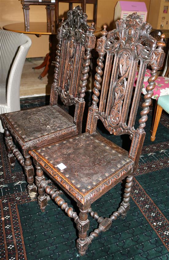 A pair of Carolean style carved oak side chairs